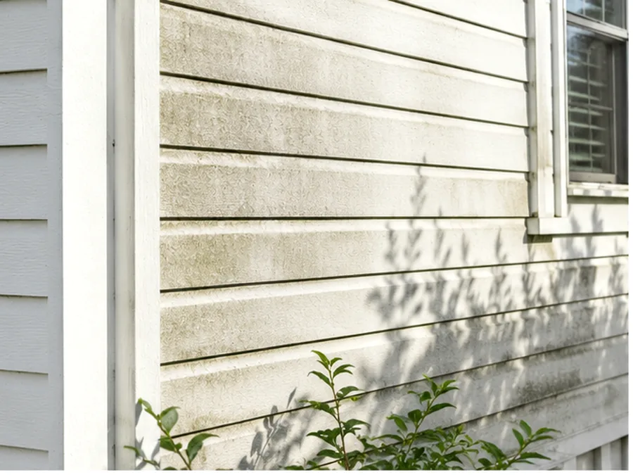 Fictional matched siding comparison showing the same surface before and after cleaning. After state.
