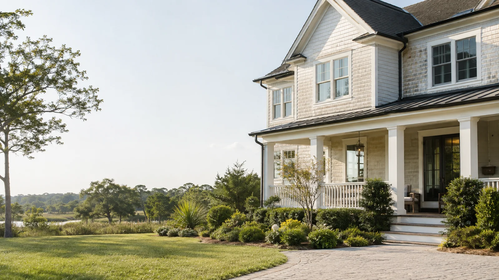 Bright coastal-style home exterior in a landscaped Mount Pleasant setting.