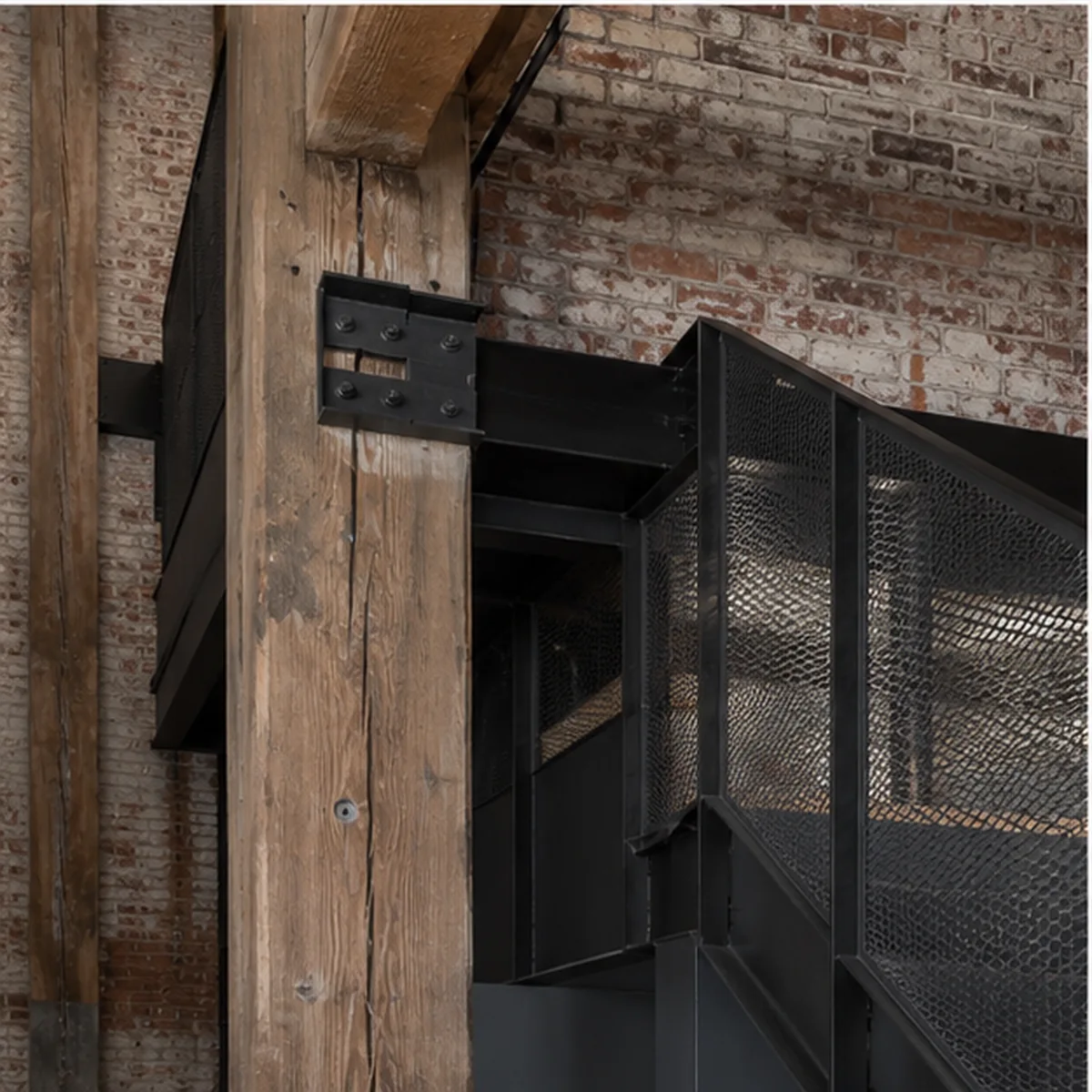North Loop structural detail joining retained timber and brick to new black steel circulation.